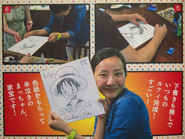 Sakura com um desenho autografado por oda.